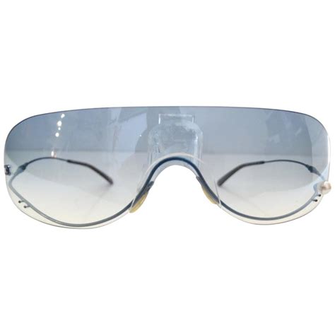 chanel blue shield crosshatch rimless mirrored sunglasses on face|Chanel Mirrored Sunglasses .